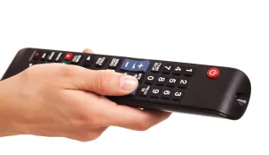 TV console in woman's hand isolated over white background daljinski televizor pretplata tv