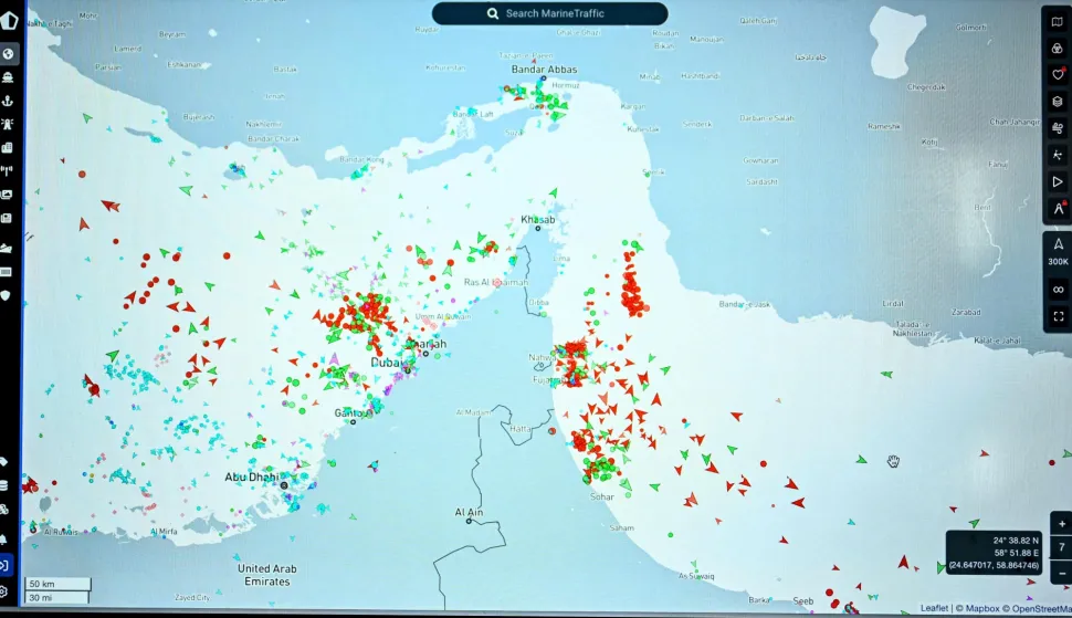 This photograph shows a page on the Marinetraffic website thats shows commercial boats traffic on the edge of the Strait of Hormuz near the Iranian coast, in Paris on March 4, 2026. (Photo by JULIEN DE ROSA/AFP)