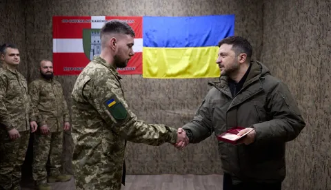 This handout photograph taken and released by the Ukrainian Presidential Press Service on March 6, 2026, shows Ukrainian President Volodymyr Zelensky (R) handing an award to a Ukrainian serviceman while visiting the main command post of the 100th Separate Mechanized Brigade, which is defending Kostyantynivka in Donetsk region, amid the Russian invasion of Ukraine. (Photo by Handout/UKRAINIAN PRESIDENTIAL PRESS SERVICE/AFP)/RESTRICTED TO EDITORIAL USE - MANDATORY CREDIT "AFP PHOTO/Ukrainian Presidential Press Service" - NO MARKETING NO ADVERTISING CAMPAIGNS - DISTRIBUTED AS A SERVICE TO CLIENTS