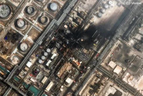 This handout satellite image courtesy of Vantor taken and released on March 2, 2026, shows damage at the Saudi Aramco's Ras Tanura refinery. Saudi Arabia's military raised its readiness levels after multiple attacks by Iran, a source close to the army told AFP on March 2, while another warned of a possible military response if its oil infrastructure is targeted. The massive Ras Tanura refinery on Saudi Arabia's Gulf coast went into partial shutdown on March 2 after a strike by drones, three days into the Middle East war. (Photo by Satellite image ?2026 Vantor/AFP)/RESTRICTED TO EDITORIAL USE - MANDATORY CREDIT "AFP PHOTO/SATELLITE IMAGE ?2026 Vantor" - HANDOUT - NO MARKETING NO ADVERTISING CAMPAIGNS - DISTRIBUTED AS A SERVICE TO CLIENTS - THE WATERMARK MAY NOT BE REMOVED/CROPPED