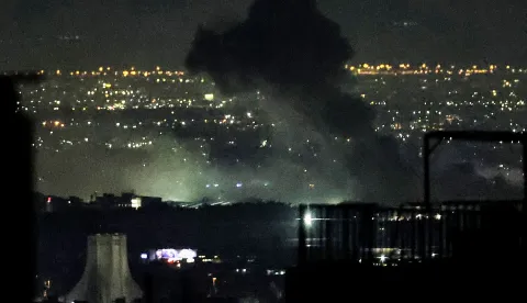 Smoke plumes billow from the site of airstrikes near Azadi Tower in western Tehran on March 10, 2026. The United States and Israel launched strikes against Iran on February 28, sparking swift retaliation by the Islamic republic which responded with missile attacks across the region. The war has dragged in global powers, upended the world's energy and transport sectors, and brought chaos to even usually peaceful areas of the volatile region. (Photo by ATTA KENARE/AFP)/Attention editors: AFP covers the war in the Middle East through its extensive regional network, including bureaus in Tehran, Jerusalem and several neighboring countries.Since the start of the conflict, journalists have been working under increasingly restrictive conditions. Authorities in several countries have limited reporters? movements, photo and live video coverage from sensitive locations. Some governments and armed groups have banned images of missile or drone strikes and other security-related sites./