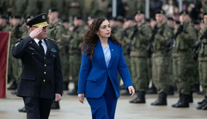 Kosovo's President Vjosa Osmani (R) flanked by the Commander of the Kosovo Security Force (KSF) Bashkim Jashari review troops as they take part in a ceremony marking the 28th anniversary of the killing of Kosovo Liberation Army (KLA) founding member and commander Adem Jashari, in Pristina on March 5, 2026. Adem Jashari, seen as the "father of the KLA", was among 45 members of his family killed by Serb security forces in the village of Prekaz some 50 km west of the Kosovo capital Pristina, sparking a full-blown rebel insurgency. (Photo by Armend NIMANI/AFP)