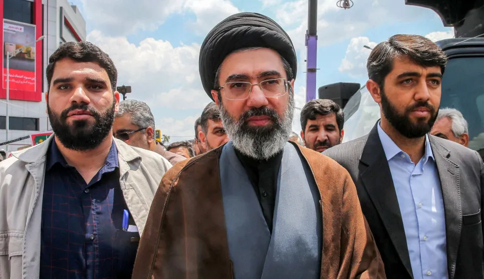 HAMENEI (FILES) In this picture obtained from Iran's ISNA news agency, Mojtaba Khamenei (C), son of Iran's supreme leader Ayatollah Ali Khamenei, walks along a street in Tehran on May 31, 2019. Iran marked the appointment of Ayatollah Mojtaba Khamenei to replace his father as its supreme leader with a new barrage of missiles against Israel and the Gulf states on March 9, 2026, as the Middle East war sent oil prices soaring. (Photo by Hamid FOROUTAN/ISNA/AFP)