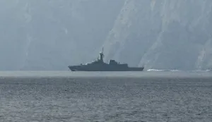 A navy vessel is seen sailing in the Strait of Hormuz, a vital waterway through which much of the world's oil and gas passes on March 1, 2026. Two ships were attacked in the Strait of Hormuz on March 1, maritime security agencies said, as Iran pressed a second day of strikes in response to US-Israeli military strikes on Iran killing it's supreme leader. (Photo by Sahar AL ATTAR/AFP)