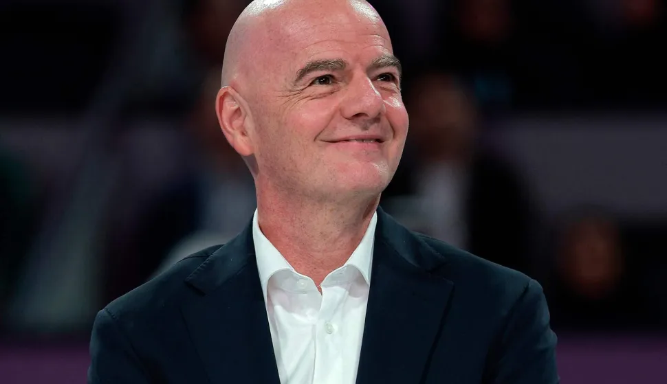 (FILES) International Association Football Federation (FIFA) President Gianni Infantino looks on at the end of the women?s singles final match, at the Qatar Open tennis tournament in Doha on February 14, 2026. FIFA President Gianni Infantino is ?very calm? about Mexico hosting the 2026 World Cup, he told AFP on February 24, 2026, after the country faced a wave of violence following the death of its biggest drug lord. (Photo by Karim JAAFAR/AFP)