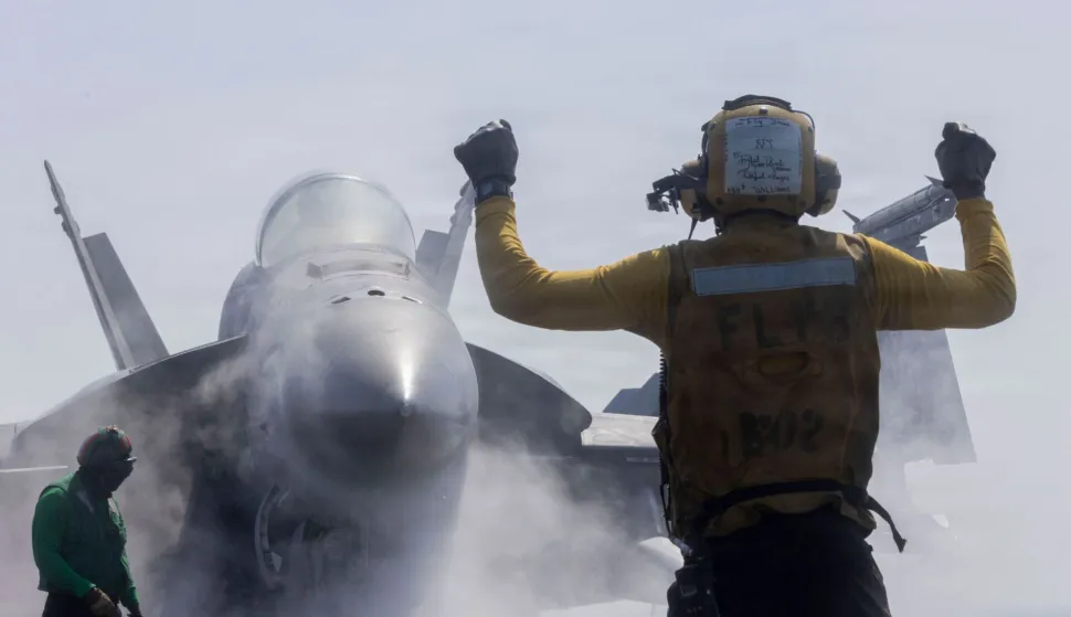 TOPSHOT - This US Navy handout photo released by US Central Command public affairs shows a F/A-18F Super Hornet, attached to Strike Fighter Squadron (VFA) 41, preparing to launch from the flight deck of Nimitz-class aircraft carrier USS Abraham Lincoln (CVN 72) in support of Operation Epic Fury, from an undisclosed location on February 28, 2026. Three members of the US military have been killed and five others wounded in the operation against Iran, the Pentagon said on March 1, announcing the first American deaths in the US-Israeli campaign that killed the Islamic republic's supreme leader. (Photo by US NAVY/US CENTRAL COMMAND/AFP)/RESTRICTED TO EDITORIAL USE - MANDATORY CREDIT "AFP PHOTO/US NAVY and US CENTRAL COMMAND/HANDOUT" - HANDOUT - NO MARKETING NO ADVERTISING CAMPAIGNS - DISTRIBUTED AS A SERVICE TO CLIENTS
