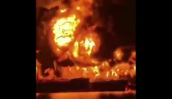 This video grab taken from UGC images posted on social media on March 12, 2026, shows two oil tankers on fire off the coast of Iraq. An attack on two oil tankers near Iraq killed at least one crew member, an Indian national, as Iran pressed a campaign aimed at disrupting global energy markets in retaliation for US and Israeli strikes. (Photo by various sources/AFP)/RESTRICTED TO EDITORIAL USE - MANDATORY CREDIT AFP - SOURCE: UGC/UNKNOWN - DISTRIBUTED AS A SERVICE TO CLIENTS - NO RESALE