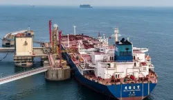 An oil tanker unloads crude oil at a terminal at the port in Qingdao, in China?s eastern Shandong province on March 11, 2026. (Photo by CN-STR/AFP)/China OUT