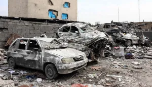A photograph shows the wreckage of cars following a strike in Tehran on March 12, 2026. The United States and Israel started striking Iran on February 28, killing the Iranian supreme leader and top military leaders, and prompting authorities to retaliate with strikes on Israel and across the Gulf. (Photo by AFP)/