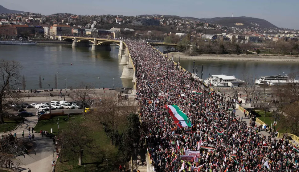 An overview shows people attending a "Peace March" in support of the government of Prime Minister's FIDESZ on the Margaret Bridge in Budapest, Hungary on March 15, 2026, on the 178th anniversary of the Hungarian Revolution and War of Independence of 1848-1849. The 1848-1849 revolution in the Kingdom of Hungary grew into a war for independence from the Austrian Empire, ruled by the Habsburg dynasty. (Photo by Peter Kohalmi/AFP)