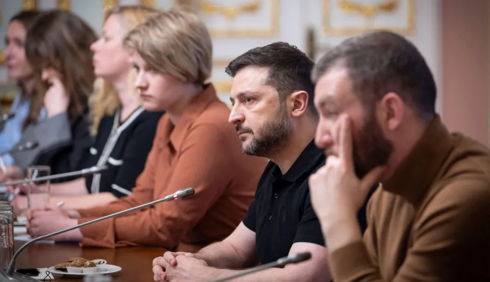 In this handout photograph taken on March 14, 2026 and released on March 15, 2026 by the Ukrainian Presidential Press Service, Ukraine's President Volodymyr Zelensky (2nd R) attends a meeting with journalists at his office in Kyiv, amid the Russian invasion of Ukraine. (Photo by Handout/UKRAINIAN PRESIDENTIAL PRESS SERVICE/AFP)/RESTRICTED TO EDITORIAL USE - MANDATORY CREDIT "AFP PHOTO/UKRAINIAN PRESIDENTIAL PRESS SERVICE" - NO MARKETING NO ADVERTISING CAMPAIGNS - DISTRIBUTED AS A SERVICE TO CLIENTS