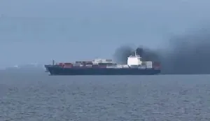This frame grab from handout UGC video footage by seafarer Wang Shang taken on March 12, 2026 and released to AFPTV on March 13 shows smoke emerging from the Source Blessing cargo vessel, as filmed from the vessel Wang was onboard in the Gulf, north of Dubai. Wang Shang, a seafarer on an LPG vessel in the Gulf, just north of Dubai, talked to AFP on March 13 morning about his experience being stuck on a ship, unable to pass through the Strait of Hormuz. (Photo by Handout/various sources/AFP)/RESTRICTED TO EDITORIAL USE - MANDATORY CREDIT "AFP PHOTO /WANG SHANG/UGC via AFPTV/HANDOUT - NO MARKETING NO ADVERTISING CAMPAIGNS - DISTRIBUTED AS A SERVICE TO CLIENTSATTENTION EDITORS: AFP IS COVERING THE WAR IN THE MIDDLE EAST THROUGH ITS EXTENSIVE REGIONAL NETWORK, INCLUDING ITS BUREAUS IN TEHRAN, BEIRUT, JERUSALEM, THE GULF MONARCHIES, IRAQ, JORDAN, SYRIA AND EGYPT. HOWEVER, SINCE THE START OF THE WAR, THE AGENCY?S JOURNALISTS HAVE BEEN WORKING UNDER INCREASINGLY RESTRICTIVE CONDITIONS. GOVERNMENTS THROUGHOUT THE REGION HAVE IMPOSED LIMITS ON JOURNALISTS? MOVEMENTS, INCLUDING THEIR ABILITY TO PROVIDE VIDEO LIVE STREAMS OF WHAT ARE REGARDED AS SENSITIVE LOCATIONS. SEVERAL GOVERNMENTS AND ARMED GROUPS HAVE BANNED PHOTO AND VIDEO COVERAGE OF MISSILE AND DRONE STRIKES ON WHAT ARE SEEN AS SECURITY-RELATED SITES, THE INTERCEPTION OF INCOMING MISSILES AND DRONES, AND THE REPORTING OF WHAT COULD BE CONSTRUED AS OPERATIONAL MILITARY DETAILS./