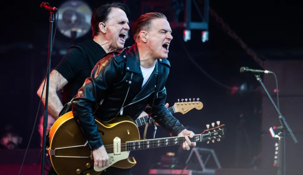 epa11444304 Canadian singer-songwriter and musician Bryan Adams (R) performs at the Tinderbox music festival in Odense, Denmark, 28 June 2024 (issued 29 June 2024). The festival runs from 27 to 29 June 2024. EPA/HELLE ARENSBAK DENMARK OUT