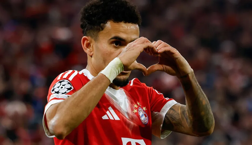 Bayern Munich's Colombian forward #14 Luis Diaz celebrates scoring the 4-0 goal with his teammates during the UEFA Champions League, Round of 16 2nd-leg football match between FC Bayern Munich and Atalanta in Munich, southern Germany, on March 18, 2026. (Photo by Alexandra BEIER/AFP)