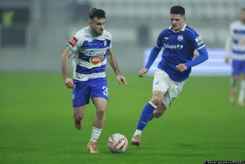 20.12.2025., stadion Opus Arena, Osijek - SuperSport HNL, 18. kolo, NK Osijek - NK Slaven Belupo. Domagoj Bukvic i Ivan Cubelic Photo: Davor Javorovic/PIXSELL