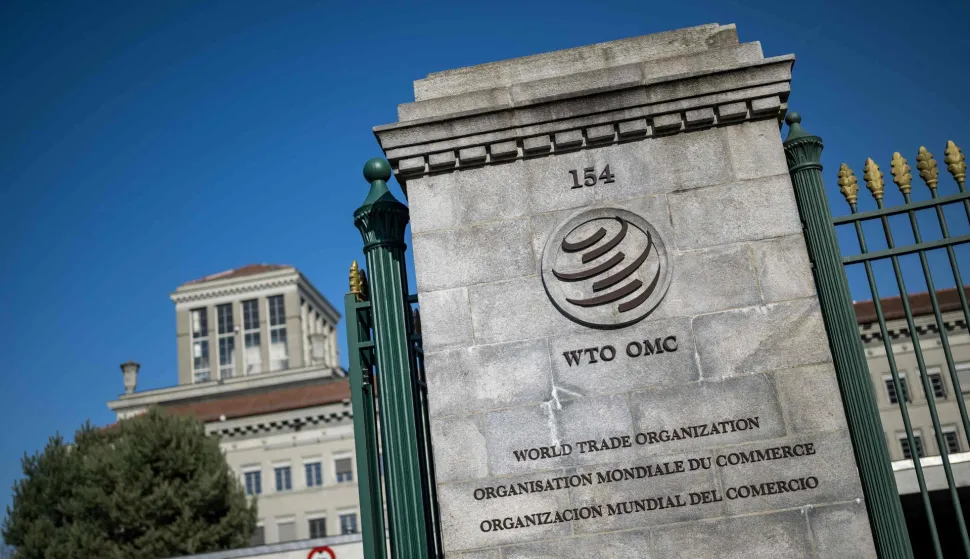 This photograph shows the headquarters of the World Trade Organization (WTO) after the launch of their global trade outlook in Geneva, on March 19, 2026. The Middle East war could weigh heavily on already slowing global trade, the WTO warned saying merchandise trade volume growth could be as low as 1.4 percent this year, compared to 4.6 percent in 2025. (Photo by Fabrice COFFRINI/AFP)