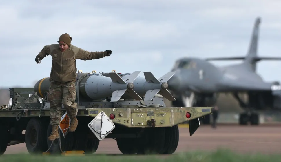 Joint Direct Attack Munitions (JDAMs) are taken away having been removed from a US Air Force B-1 Lancer bomber at RAF Fairford in south-west England on March 15, 2026. Fairford is one of two bases, along with the Diego Garcia facility in the Indian Ocean, that the UK has given the US permission to use for "specific defensive operations into Iran" to destroy Iranian missiles at source, the British defence minister said in a statement. (Photo by Henry NICHOLLS/AFP)