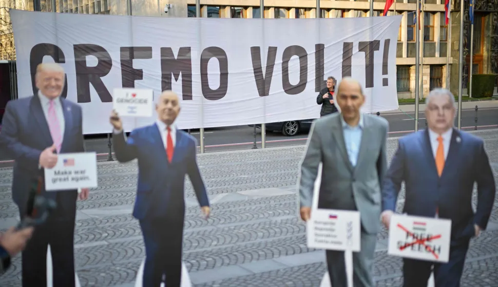 This photograph shows a banner reading "Let's vote" behind cardboard cutouts depicting (From L) US President Donald Trump, Israel's Prime Minister Benjamin Netanjahu, Slovenian opposition leader nationalist former Prime Minster Janez Jansa and Hungary Prime Minister Viktor Orban outside of Slovenian Parliament in Ljubljana on March 20, 2026, as demonstrators gather at a rally to urge citizens to vote ahead of the parliamentary elections. Slovenians voters are scheduled to head to the polls of parliamentary elections on March 22, 2026. (Photo by Jure Makovec/AFP)