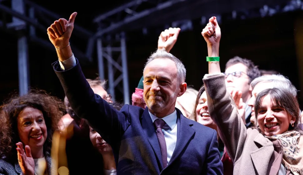 Socialist Party (PS) Member of Parliament and left wing Paris mayoral candidate Emmanuel Gregoire (C) celebrates during a gathering following the second round of France's 2026 municipal elections in Paris on March 22, 2026. Gregoire was elected Paris mayor in the French capital's municipal elections. (Photo by GEOFFROY VAN DER HASSELT/AFP)