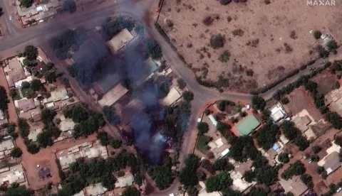 epa10577401 A handout satellite image made available by Maxar Technologies shows burning buildings and a millitary patrol northeast of Khartoum International Airport, in Khartoum, Sudan, 17 April 2023. Heavy gunfire and explosions were reported in Sudan's capital Khartoum since 15 April between the army and a paramilitary group following days of tension centering around the country's proposed transition to civilian rule. EPA/MAXAR TECHNOLOGIES HANDOUT -- MANDATORY CREDIT: SATELLITE IMAGE 2023 MAXAR TECHNOLOGIES -- THE WATERMARK MAY NOT BE REMOVED/CROPPED -- HANDOUT EDITORIAL USE ONLY/NO SALES