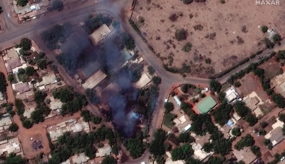 epa10577401 A handout satellite image made available by Maxar Technologies shows burning buildings and a millitary patrol northeast of Khartoum International Airport, in Khartoum, Sudan, 17 April 2023. Heavy gunfire and explosions were reported in Sudan's capital Khartoum since 15 April between the army and a paramilitary group following days of tension centering around the country's proposed transition to civilian rule. EPA/MAXAR TECHNOLOGIES HANDOUT -- MANDATORY CREDIT: SATELLITE IMAGE 2023 MAXAR TECHNOLOGIES -- THE WATERMARK MAY NOT BE REMOVED/CROPPED -- HANDOUT EDITORIAL USE ONLY/NO SALES