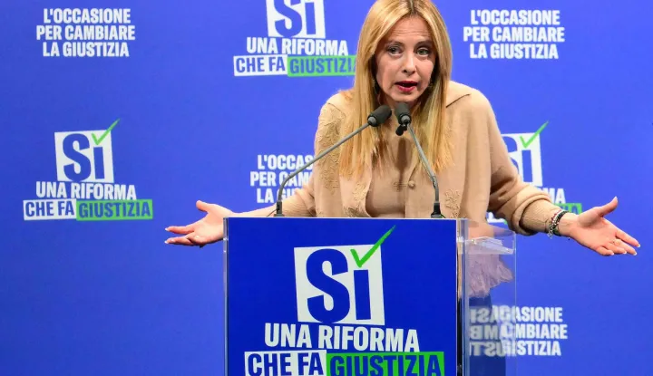 (FILES) Italy's Prime Minister Giorgia Meloni speaks during a campaign meeting of Italian right wing party Brothers of Italy (Fratelli d'Italia) (Fdi) to support the "Yes" to Justice referendum, in Milan on March 12, 2026. Italian Prime Minister Giorgia Meloni on March 23, 2026 conceded defeat in a referendum on her justice reforms, while confirming she would not hand in her resignation. (Photo by Stefano RELLANDINI/AFP)