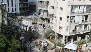 Israeli emergency service personnel gather at the site of an Iranian missile strike in Tel Aviv on March 24, 2026. Iran launched a new wave of missiles against Israel on March 24, hours after US President Donald Trump hailed "very good" talks to end the war despite Tehran denying any dialogue had taken place. (Photo by Jack GUEZ/AFP)/