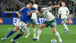 Northern Ireland's striker #10 Jamie Donley fights for the ball with Italy's defender #23 Gianluca Mancini during the play-off FIFA World Cup 2026 European qualification semi-final football match between Italy and North Ireland at the Gewiss stadium in Bergamo, on March 26, 2026. (Photo by Alberto PIZZOLI/AFP)