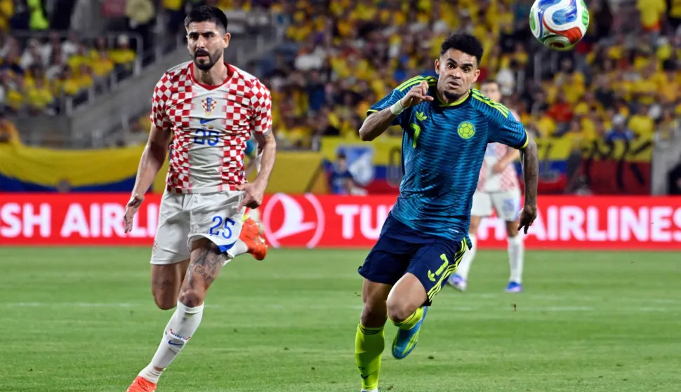Colombia's forward #07 Luis Diaz and Croatia's defender #25 Martin Erlic vie for the ball during a friendly football match between Colombia and Croatia at Camping World Stadium in Orlando, Florida, on March 26, 2026. (Photo by Miguel J. Rodriguez CARRILLO/AFP)
