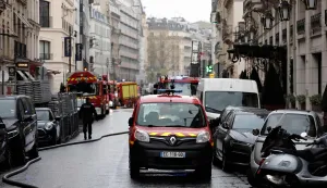 Firefighters work on the site of the Brisol Hotel where a "fairly large" fire broke out in the basement of the Hotel in Paris on March 25, 2026. Around 100 firefighters are on site to tackle this ?fairly large ongoing fire?, the Paris Fire Brigade said, confirming a report by Europe 1. Three people have suffered minor injuries, it added. Located on Rue du Faubourg Saint-Honore, not far from the Elysee Palace, the Bristol is a luxury hotel owned by the German multinational Oetker. (Photo by STEPHANE DE SAKUTIN/AFP)