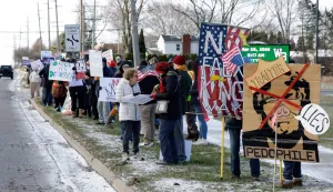 Demonstrators take part in the "No Kings" national day of protest in West Bloomfield, Michigan, a suburb of Detroit, on March 28, 2026. Nationwide protests against US President Donald Trump are expected Saturday as millions of people vent fury over what they see as his authoritarian bent and other forms of cruel, law-trampling governance. It is the third time in less than a year that Americans will take to the streets as part of a grassroots movement called "No Kings," the most vocal and visual conduit for opposition to Trump since he began his second term in January 2025. (Photo by JEFF KOWALSKY/AFP)