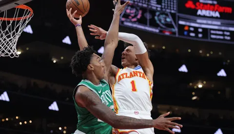 ATLANTA, GEORGIA - MARCH 30: Jalen Johnson #1 of the Atlanta Hawks shoots against Amari Williams #77 of the Boston Celtics during the second half at State Farm Arena on March 30, 2026 in Atlanta, Georgia. NOTE TO USER: User expressly acknowledges and agrees that, by downloading and or using this Photograph, user is consenting to the terms and conditions of the Getty Images License Agreement. Jonathan Bachman/Getty Images/AFP (Photo by Jonathan Bachman/GETTY IMAGES NORTH AMERICA/Getty Images via AFP)