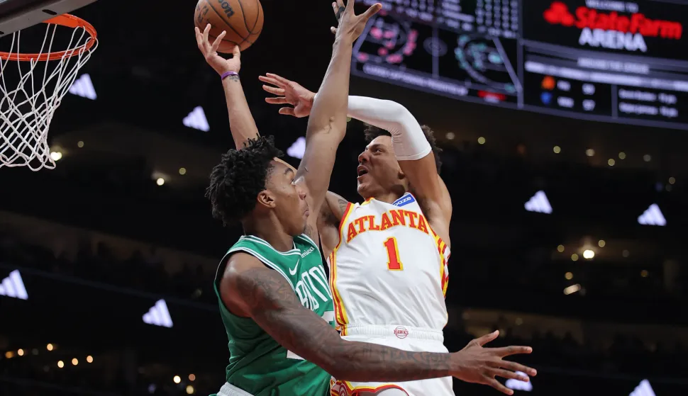 ATLANTA, GEORGIA - MARCH 30: Jalen Johnson #1 of the Atlanta Hawks shoots against Amari Williams #77 of the Boston Celtics during the second half at State Farm Arena on March 30, 2026 in Atlanta, Georgia. NOTE TO USER: User expressly acknowledges and agrees that, by downloading and or using this Photograph, user is consenting to the terms and conditions of the Getty Images License Agreement. Jonathan Bachman/Getty Images/AFP (Photo by Jonathan Bachman/GETTY IMAGES NORTH AMERICA/Getty Images via AFP)