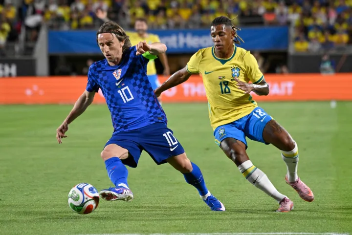 Croatia's midfielder #10 Luka Modric and Brazil's midfielder #18 Danilo De Oliveira vie for the ball during a friendly football match between Brazil and Croatia at Camping World Stadium in Orlando, Florida, on March 31, 2026. (Photo by MIGUEL J RODRIGUEZ CARRILLO/AFP)