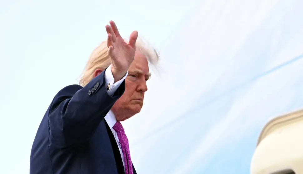 US President Donald Trump boards Air Force One prior to departure from Palm Beach International Airport in West Palm Beach, Florida, March 29, 2026. US President Donald Trump is returning to the White House after spending the weekend at his Mar-a-Lago residence. (Photo by Mandel NGAN/AFP)