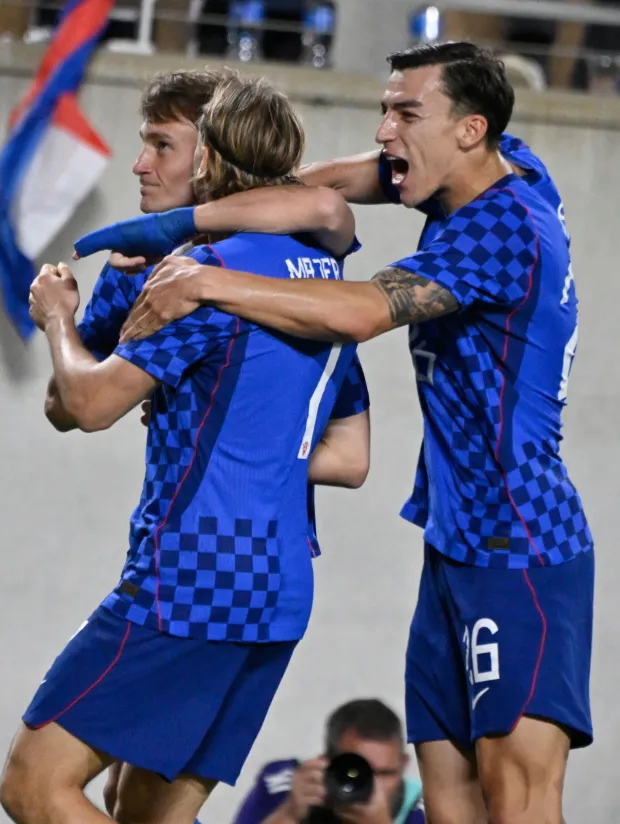 Croatia's midfielder #07 Lovro Majer celebrates scoring his team's first goal with teammates during a friendly football match between Brazil and Croatia at Camping World Stadium in Orlando, Florida, on March 31, 2026. (Photo by MIGUEL J RODRIGUEZ CARRILLO/AFP)