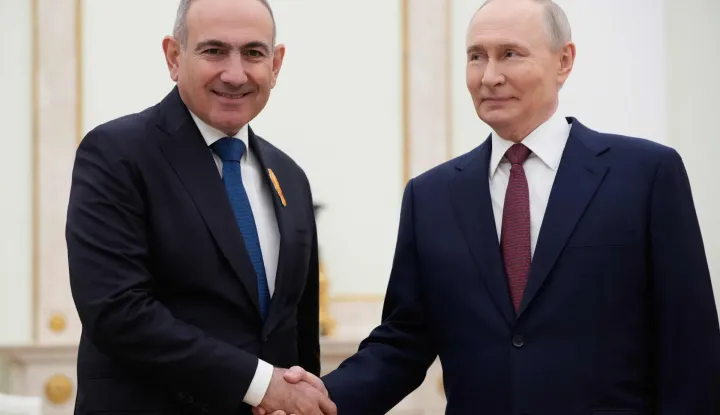 Russian President Vladimir Putin (R) greets Armenian Prime Minister Nikol Pashinyan prior to their meeting at the Kremlin in Moscow, on April 1, 2026. (Photo by Pavel Bednyakov/POOL/AFP)