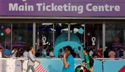 (FILES) Football fans line up outside the Main Ticketing Centre to try to get match tickets on November 18, 2022 in Doha, Qatar, ahead of the Qatar 2022 World Cup football tournament. The Football Supporters Europe (FSE) group filed a lawsuit on March 24, 2026, with the European Commission against football's world governing body FIFA over "excessive ticket prices" for this year's World Cup finals. (Photo by David GANNON/AFP)