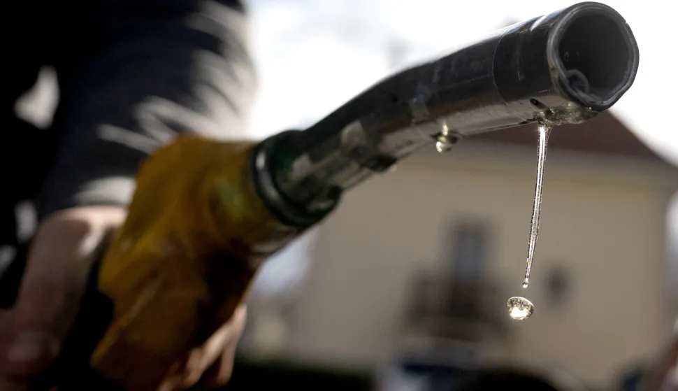 TOPSHOT - Drops of petrol fall from the nozzle of a petrol pump at a gas station in Mulhouse, eastern France, on April 1, 2026, as US-Israel war on Iran, launched on February 28, has roiled global energy and equities markets, sending oil prices skyrocketing after Tehran virtually closed the key Strait of Hormuz. (Photo by SEBASTIEN BOZON/AFP)