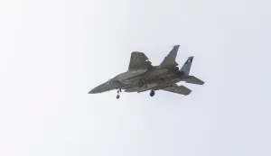 An Israeli Air Force F-15 fighter jet flies over the outskirts of Tel Aviv on March 20, 2026. The United States and Israel began the war on February 28, 2026, by attacking Iran and killing its supreme leader. Iran retaliated with strikes against Israel and US allies and interests across the Gulf and Iraq, drawing the whole region into war (Photo by Ilia YEFIMOVICH/AFP)/