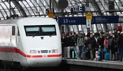 An ICE (Inter City Express) train by German railway operator Deutsche Bahn (DB) is pictured on March 27, 2026 at the main train station in Berlin. (Photo by RALF HIRSCHBERGER/AFP)