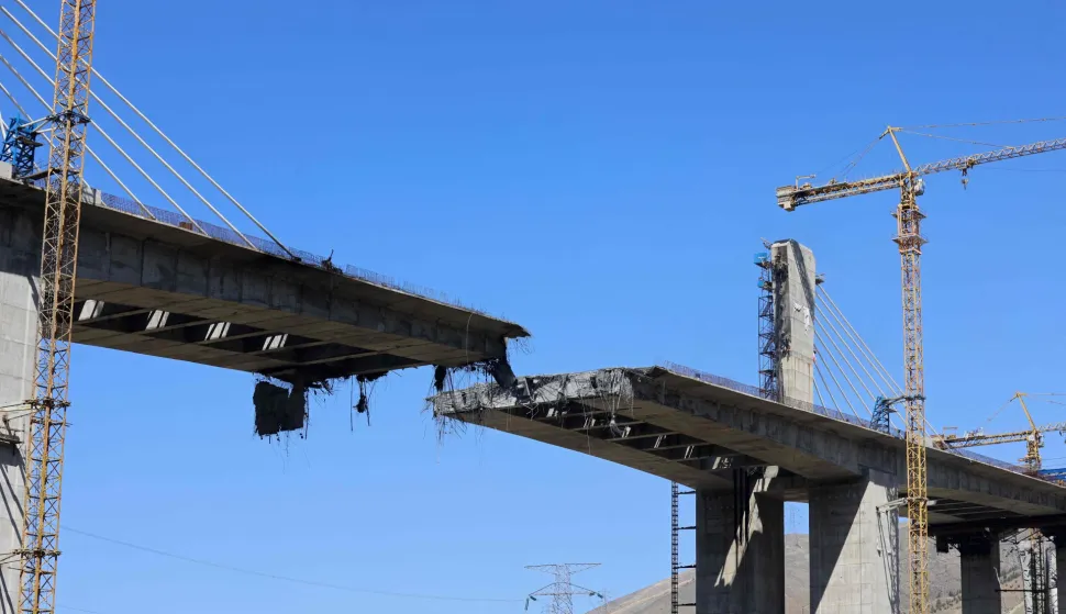 A view of the B1 bridge is pictured, a day after it was destroyed by a strike in Karaj, around 20miles (35kms) southwest of Tehran, April 3, 2026. US President Donald Trump said on April 2 the tallest bridge in Iran had been destroyed, hours after threatening to bomb the country "back to the Stone Ages." (Photo by ATTA KENARE/AFP)