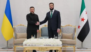 This handout photograph released by the official Syrian Arab News Agency (SANA) shows Ukraine's President Volodymyr Zelensky (L) and Syrian President Ahmed al-Sharaa shaking hands during their meeting in Damascus on April 5, 2026. The visit follows Zelensky's trip to Turkey on April 4 and a Gulf tour the week before against the backdrop of the war in the Middle East, where he sought to clinch security deals and exchange Ukrainian drone expertise for air defence missiles. (Photo by SANA/AFP)/XGTY/RESTRICTED TO EDITORIAL USE - MANDATORY CREDIT "AFP PHOTO/SANA" - HANDOUT - NO MARKETING NO ADVERTISING CAMPAIGNS - DISTRIBUTED AS A SERVICE TO CLIENTS