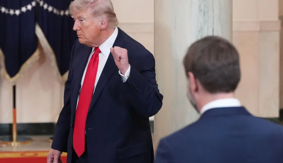US Vice President JD Vance watches as US President Donald Trump gestures after speaking at a televised address on the conflict in the Middle East from the Cross Hall of the White House in Washington, DC on April 1, 2026. (Photo by Alex Brandon/POOL/AFP)