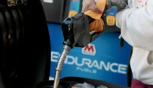 MIAMI, FLORIDA - APRIL 06: Olga Perez puts fuel in her scooter at a gas station on April 06, 2026 in Miami, Florida. Florida gas prices have risen to over  per gallon in early April 2026 as the war in Iran has affected global oil supplies, leading to higher crude oil costs. Joe Raedle/Getty Images/AFP (Photo by JOE RAEDLE/GETTY IMAGES NORTH AMERICA/Getty Images via AFP)