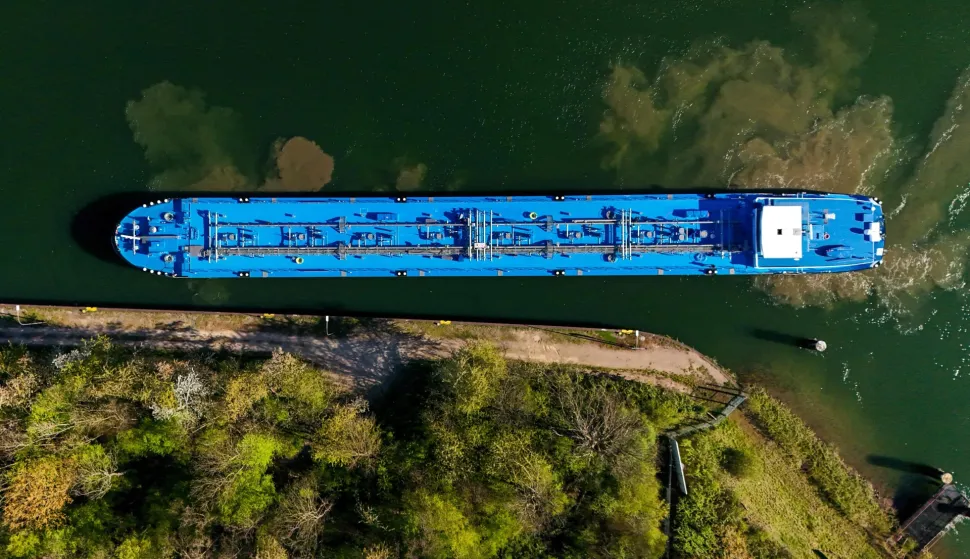 An aerial view shows a tanker near the fuel depot of Aral at the Ruhr Oel petroleum refineries of BP Gelsenkirchen GmbH in Gelsenkirchen, western Germany on April 7, 2026. The Iran war sent oil prices soaring on March 9, 2026 after Tehran, under new leader Mojtaba Khamenei, fired a new barrage of missiles at its Gulf neighbours and signalled that the strategic Strait of Hormuz would likely remain shut.With the Strait of Hormuz off Iran remaining closed to almost all oil tankers, the price of benchmark crude oil contracts rocketed past $100 a barrel on Monday -- their highest levels since Russia's invasion of Ukraine in 2022 -- before edging back slightly. (Photo by Ina FASSBENDER/AFP)