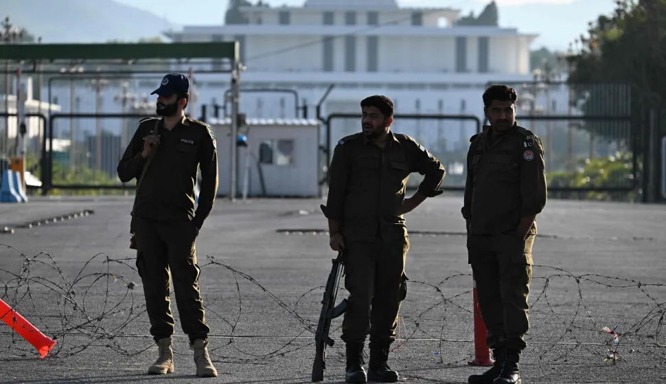 Pakistani police officers stand guard near the President House in the Red Zone area in Islamabad on April 10, 2026. Pakistan has been preparing for high-stakes talks involving US and Iranian representatives over the war in the Middle East, with the White House saying Vice President JD Vance will be leading a team to the negotiations in Islamabad "this weekend". (Photo by Aamir QURESHI/AFP)