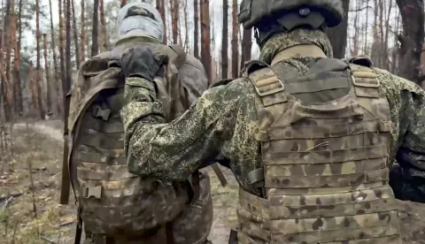 epa12571635 A still image taken from a handout video provided by the Russian Defence Ministry press service on 05 December 2025 shows a Russian serviceman escorting a captured Ukrainian serviceman in an undisclosed location in Ukraine. EPA/RUSSIAN DEFENCE MINISTRY PRESS SERVICE/HANDOUT BEST QUALITY AVAILABLEHANDOUT EDITORIAL USE ONLY/NO SALES