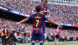 Barcelona's Spanish forward #07 Ferran Torres celebrates with Barcelona's Spanish forward #10 Lamine Yamal scoring his team's second goal during the Spanish league football match between FC Barcelona and RCD Espanyol at the Camp Nou stadium in Barcelona on April 11, 2026. (Photo by Josep LAGO/AFP)