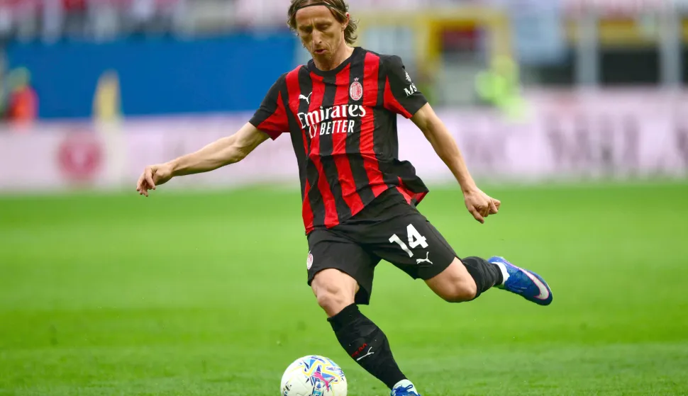 AC Milan's Croatian midfielder #14 Luka Modric shoots the ball during the Italian Serie A football match between AC Milan and Udinese at the San Siro stadium in Milan on April 11, 2026. (Photo by MARCO BERTORELLO/AFP)
